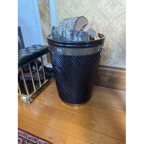 379 - Good quality Irish mahogany brass bound spiral peat bucket with shell motif in the Georgian manner. ... 