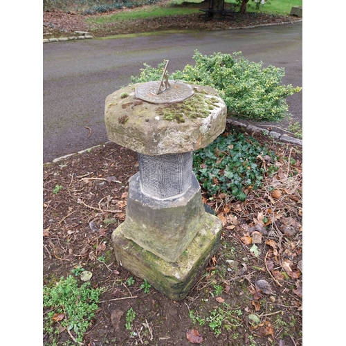 38 - Sandstone and limestone sundial with brass dial. {92 cm H x 40 cm W x 40 cm D}.