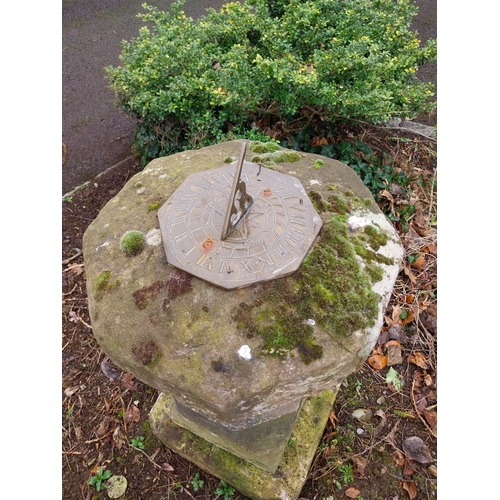 38 - Sandstone and limestone sundial with brass dial. {92 cm H x 40 cm W x 40 cm D}.