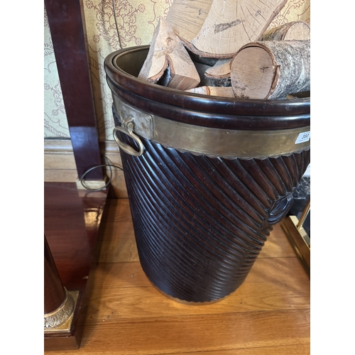 380 - Good quality Irish mahogany brass bound spiral peat bucket with shell motif in the Georgian manner. ... 