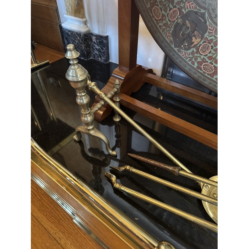 383 - Set of Edwardian brass fire irons and dogs. {28 cm H x 64 cm W}.