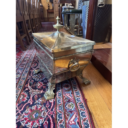 385 - Edwardian brass lidded sarcophagus coal bucket. {40 cm H x 45 cm W x 32 cm D}.