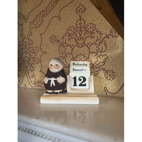 387 - Pair of novelty Hummel pottery desk calendars in the form of Monks. {8 cm H x 10 cm W x 5 cm D}.