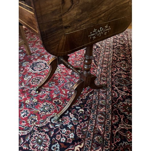 426 - Good quality Regency and rosewood brass inlaid occasional table,raised  on lion�s paw feet. {71 cm H... 