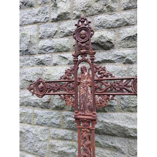 43 - 19th C. Decorative cast iron cross on limestone base. {196 cm H x 96 cm W x 38 cm D}.