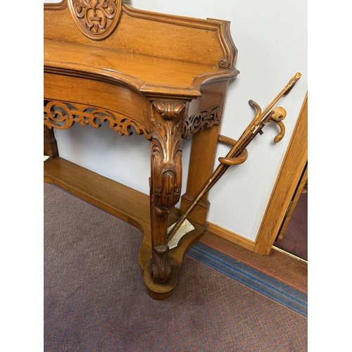 446 - 19th C oak hall console table and stick stand with carved gallery back,raised  on cabriole legs. {14... 