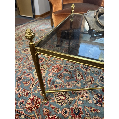 452 - Early 20th C. Brass coffee table with inset glass top in the Regency style. {48 cm H x 117 cm W x 57... 