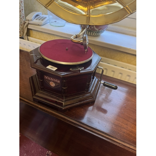 497 - Mahogany gramaphone with brass horn.