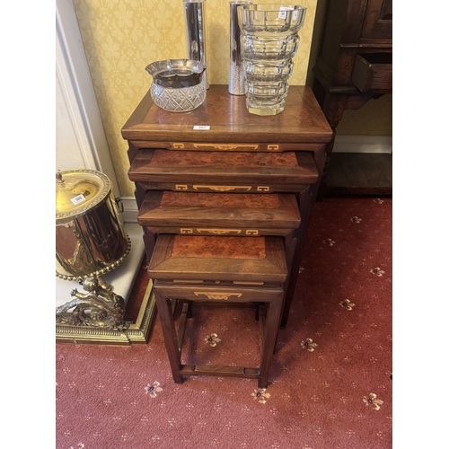 507 - Nest of four rosewood and burr walnut tables, in the Oriental manner. {60 cm H x 50 cm W x 35 cm D}.