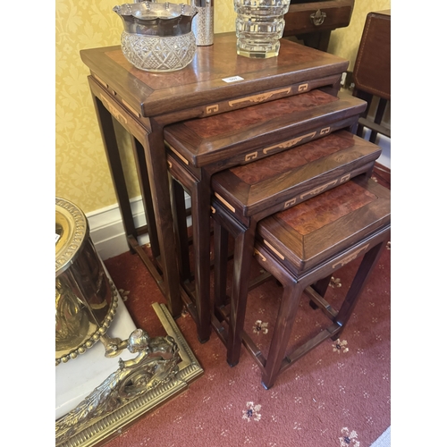 507 - Nest of four rosewood and burr walnut tables, in the Oriental manner. {60 cm H x 50 cm W x 35 cm D}.