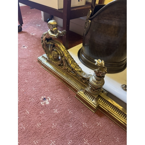 508 - Exceptional quality French brass extendable fire fender decorated with cherubs. {28 cm H x 180 cm W ... 