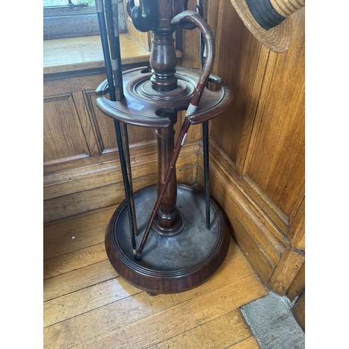 51 - 19th. C. mahogany twelve branch hallstand with turned column and circular base raised on bun feet. {... 