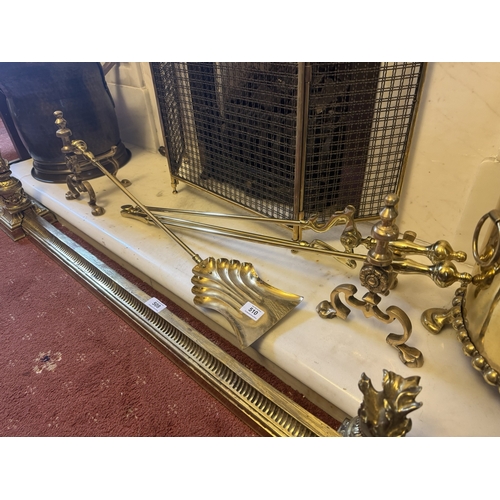 510 - Edwardian set of brass fire irons and dogs. {24 cm H x 86 cm W x 15 cm D}.