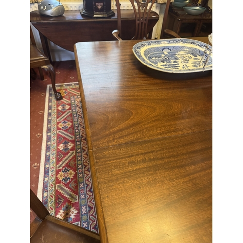 519 - 1950's mahogany dining table, raised on square tapered legs. {74 cm H x 182 cm W x 120 cm D}.