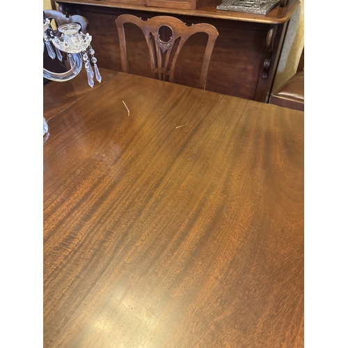 519 - 1950's mahogany dining table, raised on square tapered legs. {74 cm H x 182 cm W x 120 cm D}.