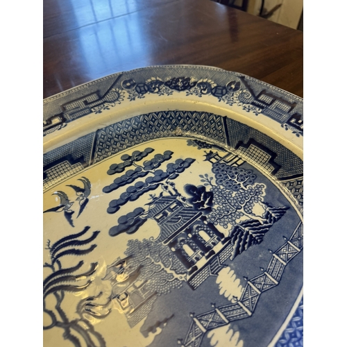 521 - Early 20th C. Willow pattern meat platter. {42 cm H x 51 cm W}.