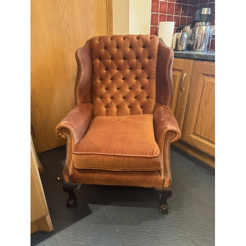 542 - 1950's mahogany and deep buttoned upholstered armchair. {103 cm H x 76 cm W x 80 cm D}.