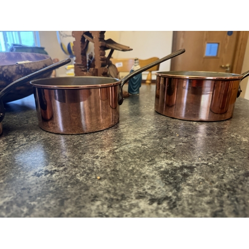 547 - Set of five graduated French copper and wrought iron saucepans. {18 cm H x 38 cm W x 31 cm D to 12 c... 