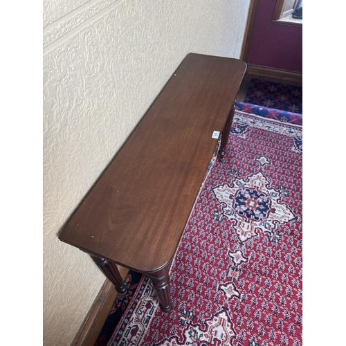 567 - Will. IV. Mahogany side table raised on reeded legs and brass casters. { 71cm H X 112cm W X 31cm D }... 