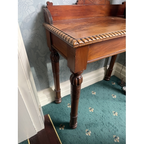 574 - 19th. C. carved mahogany side table with gallery back, raised on turned legs. { 101cm H X 84cm W X 4... 