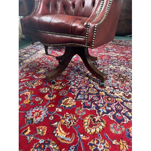 583 - Good quality hand dyed French ox blood leather deep buttoned swivel office chair  with brass stud de... 