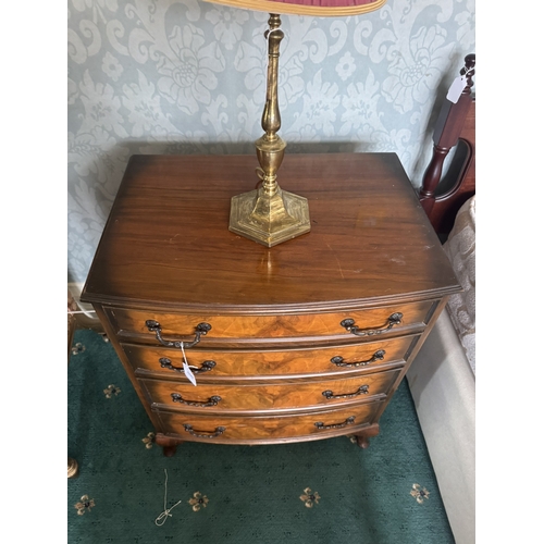 600 - Pair of walnut bow fronted bedside chests, the four graduated drawers with burr walnut, raised on Qu... 