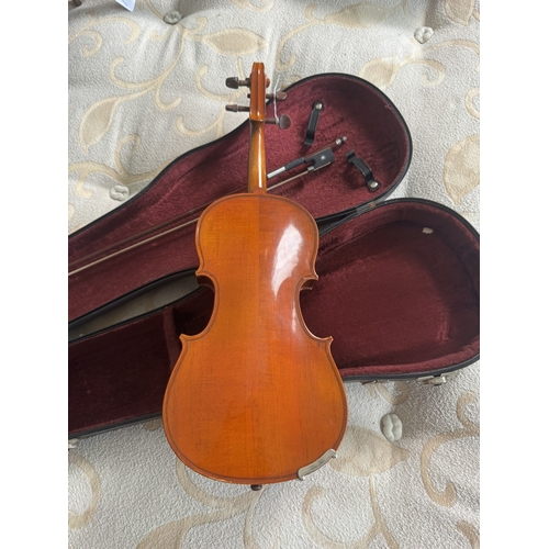 606 - Violin with bow,  in case. { 53cm L }.