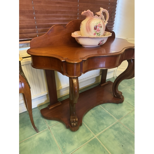 620 - 19th. C. mahogany dressing table, the shaped gallery back above a shaped front, raised on scrolled l... 