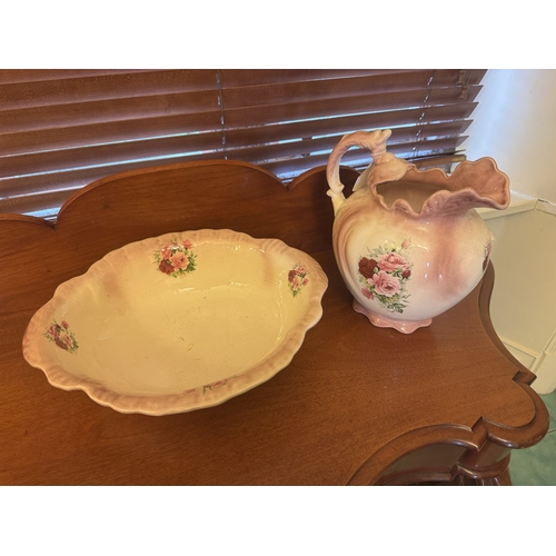 622 - 20th. C. ceramic jug and basin set decorated with roses. { 30cm H X 40cm X 31cm D }.