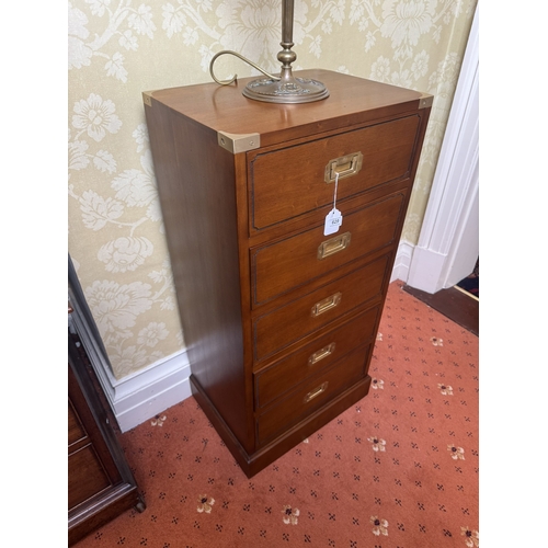 629 - Pair of mahogany campaign chest with five short drawers and brass mounts, raised on plinth bases. { ... 