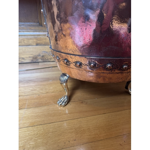 63 - 19th. C. copper and brass log bucket, raised on paw feet. { 47cm H X 61cm Dia }.