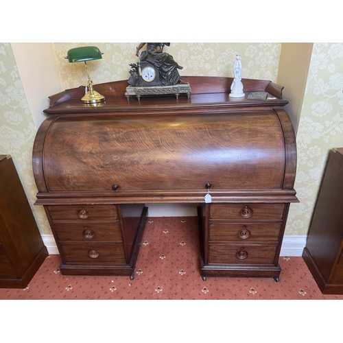 632 - Very fine quality 19th. C. mahogany cylinder top writing desk, the gallery back above the cylinder t... 