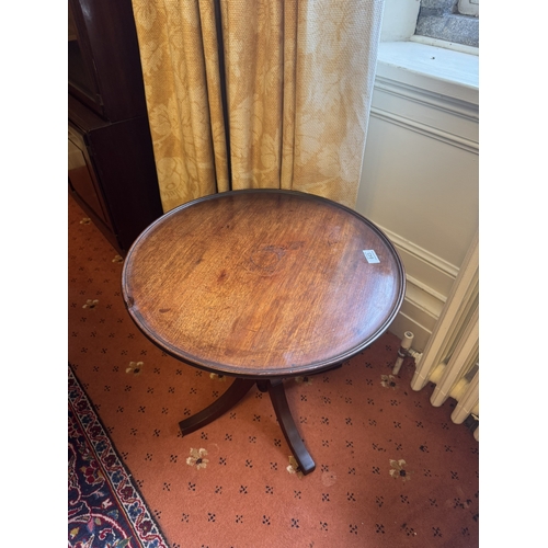 643 - Georgian mahogany wine table on later turned column and three ouswept legs . { 47cm H X 51cm Dia}.