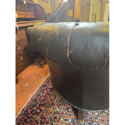 645 - Pair of 19th C hand dyed leather deep buttoned Chesterfield club chairs on tapered feet and castors.... 