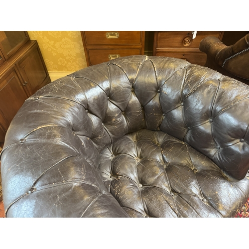 645 - Pair of 19th C hand dyed leather deep buttoned Chesterfield club chairs on tapered feet and castors.... 