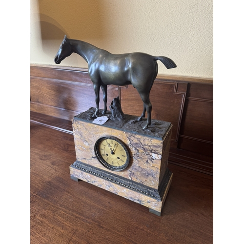 66 - 19th. C. sienna marble mantle clock with bronze mounted and surmounted with a bronze model of a hors... 