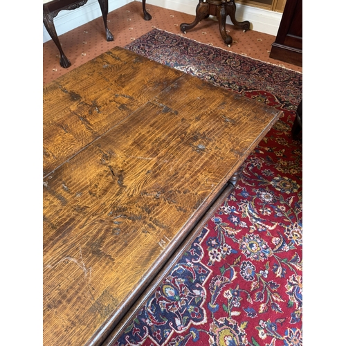 666 - 20th. C. oak reading table, raised on turned legs and with lower shelf. { 47cm H X 153cm W X 92cm D ... 