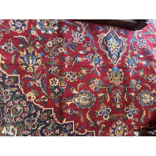 673 - Good quality hand knotted carpet square. { 392cm L X 270cm W }.