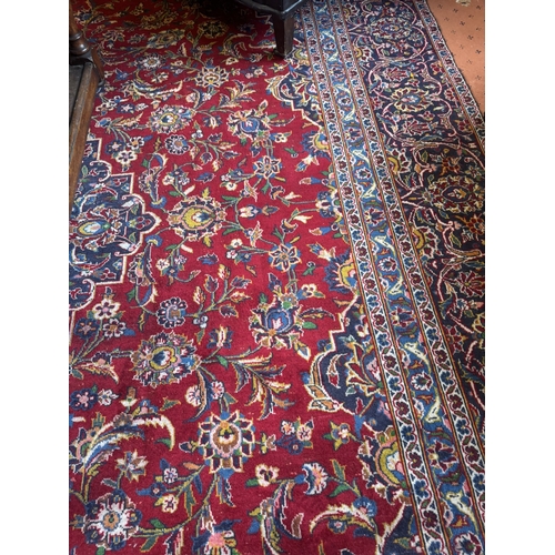 673 - Good quality hand knotted carpet square. { 392cm L X 270cm W }.