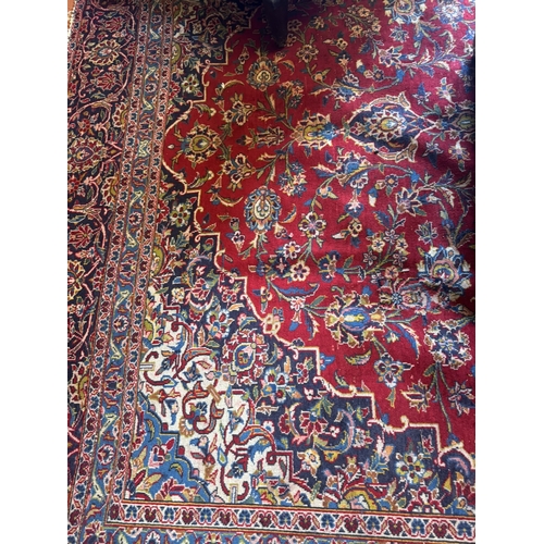 673 - Good quality hand knotted carpet square. { 392cm L X 270cm W }.