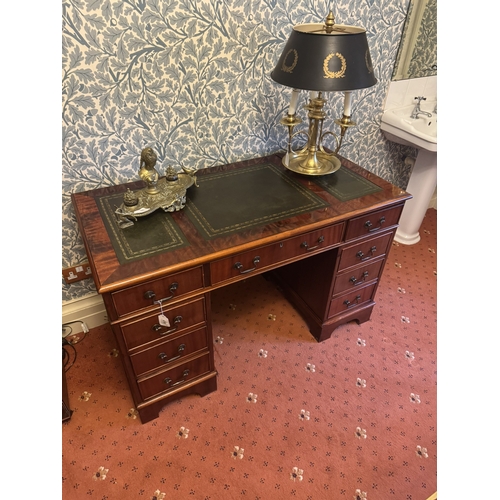 676 - Late 20th. C. mahogany knee holed desk with tooled leather top the centre drawer flanked with two sh... 