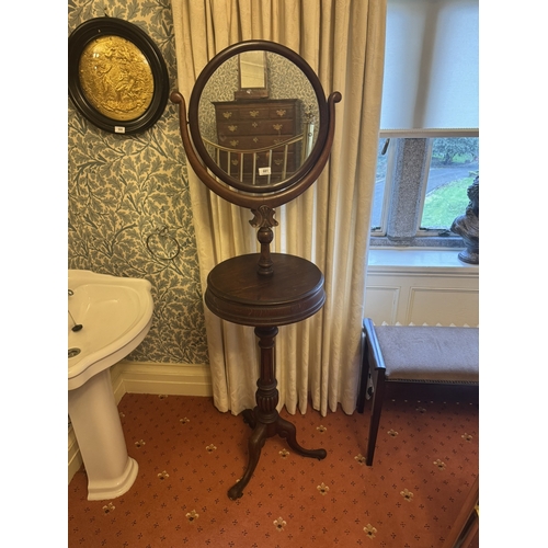 681 - 19th. C. mahogany gentleman's shaving mirror mounted on reeded column and three outswept feet. { 163... 