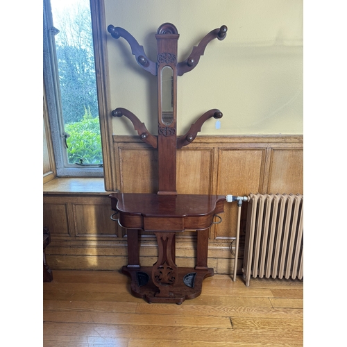 69 - 19th. C. mahogany four branch hallstand with mirror in back above a single drawer in the frieze. { 1... 