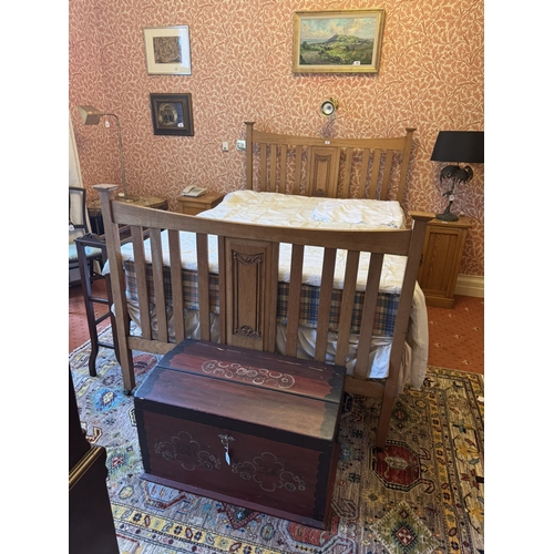 697 - Art Nouveau oak bed with mattress. { 139cm H X 137cm W }.