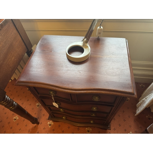 707 - Neat 20th. C. mahogany bowfronted chest, the two short drawers over three long drawers, raised with ... 