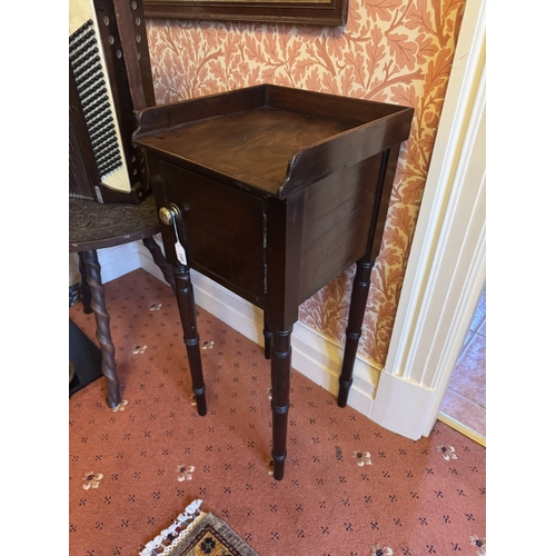 720 - Georgian mahogany pot cupboard, the gallery back above a single door, raised on tapered ringed legs.... 