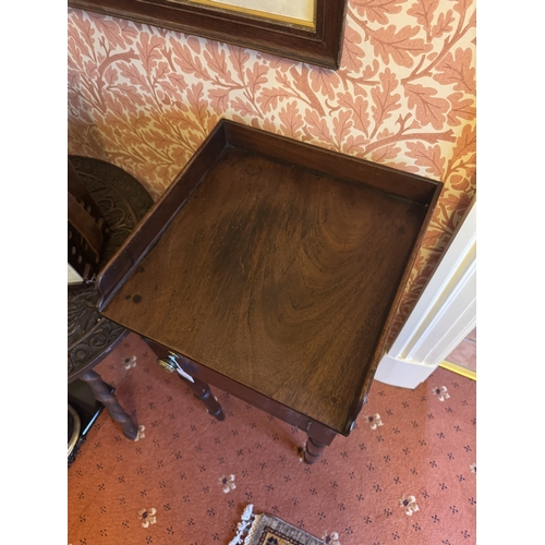 720 - Georgian mahogany pot cupboard, the gallery back above a single door, raised on tapered ringed legs.... 