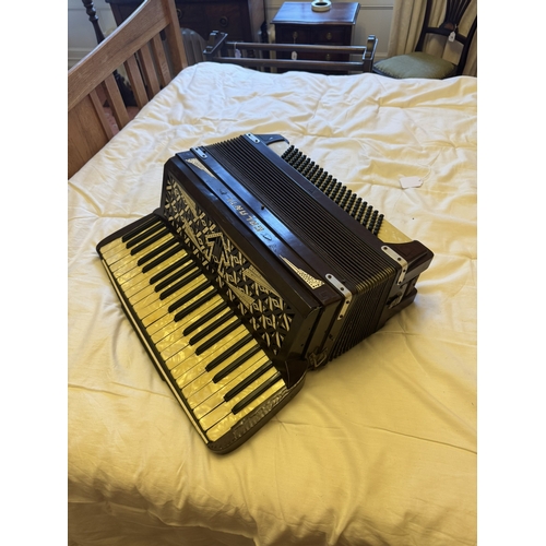 722 - Calanti Piano accordian in the Art Deco manner. { 53cm H X 40cm W X 24cm D }.