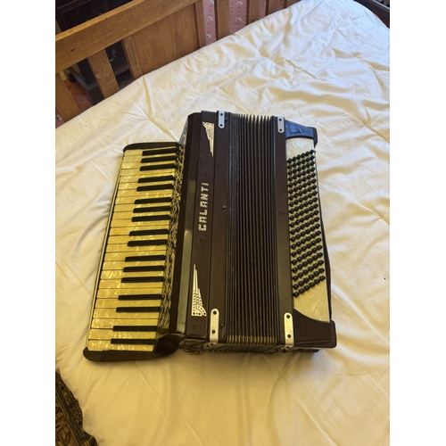 722 - Calanti Piano accordian in the Art Deco manner. { 53cm H X 40cm W X 24cm D }.