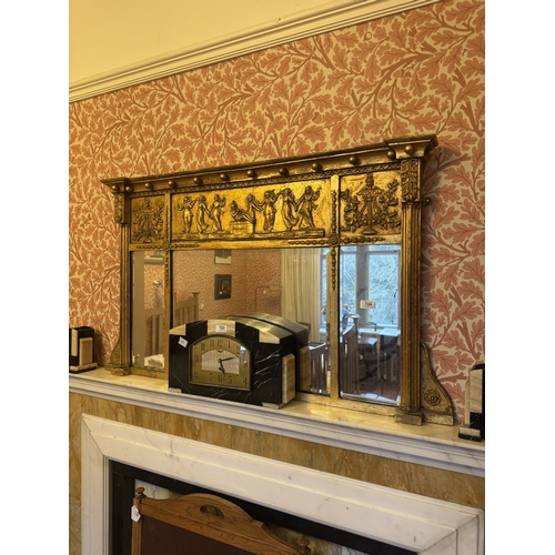 724 - Regency gilt overmantle, the inverted breakfront cornice with ball mounts above a frieze depicting d... 